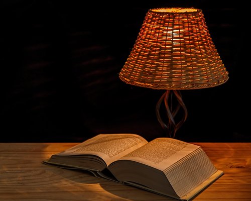 Cozy reading corner with warm artificial lamp light
